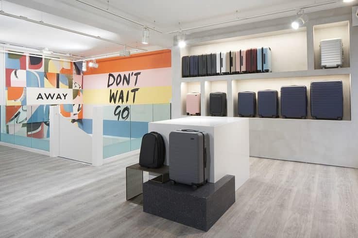 A minimal retail space with a large colourful mural along one wall